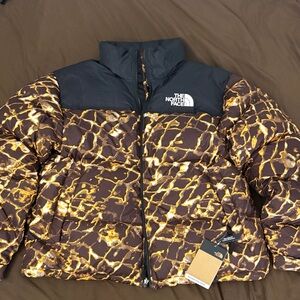The North Face Black and Gold Patterned Jacket